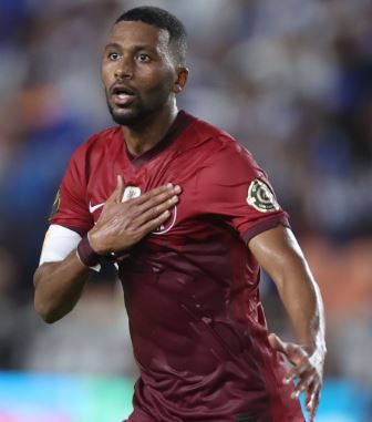 Abdulaziz Hatem celebrating after scoring a goal for the Qatar national team